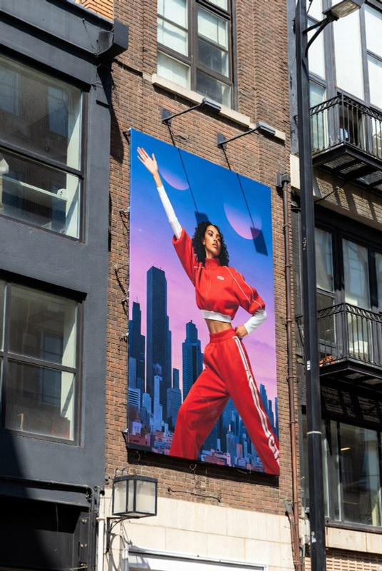 Large outdoor advertising display installed on a city building